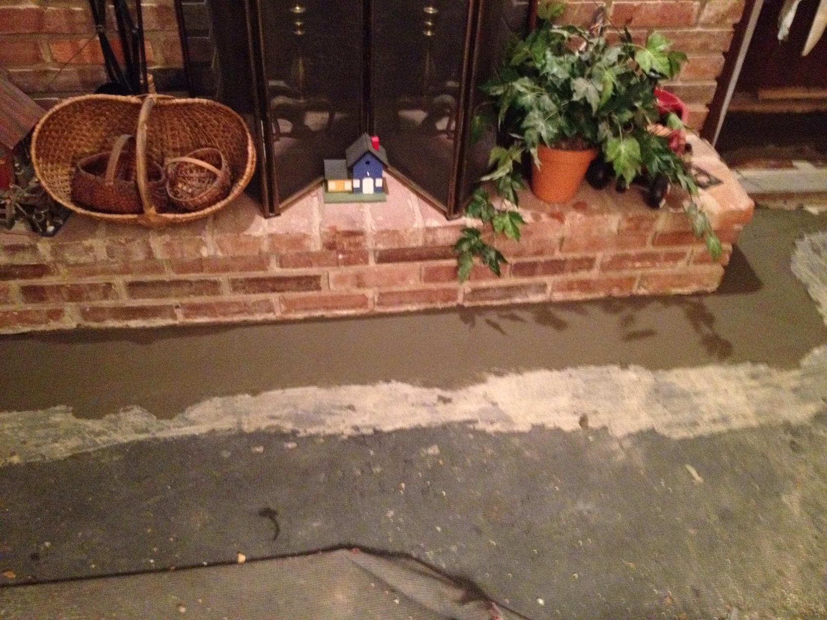 Basement Waterproofing Waterproofing around a fireplace & bookshelf