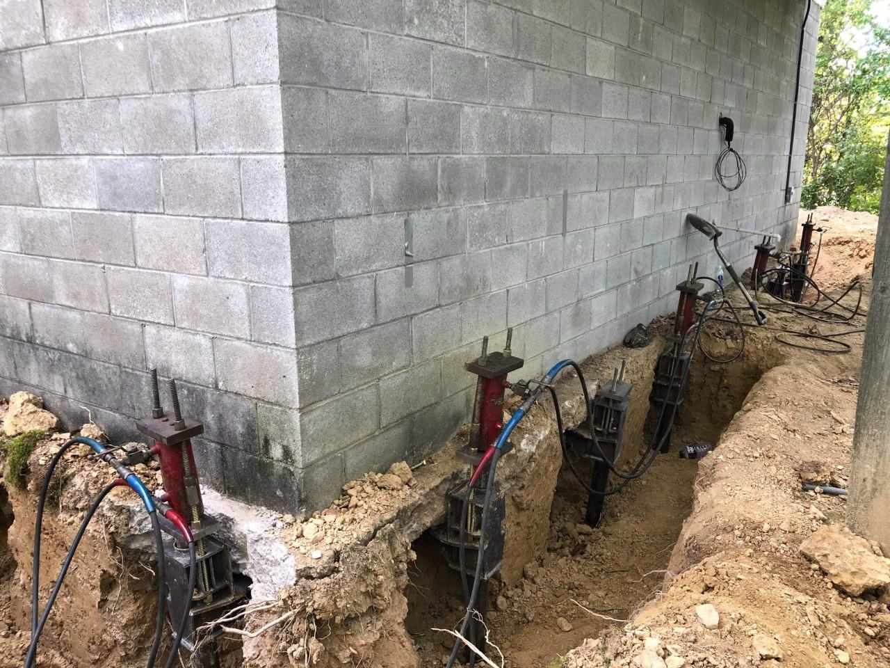 Commercial Foundations Helical Piers used to resolve sinking addition