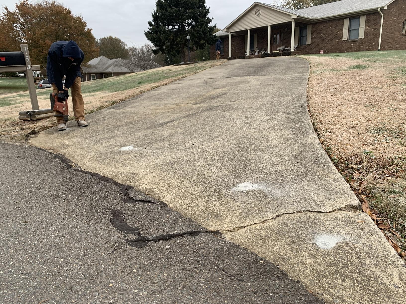 Concrete Driveway Repair in Advance, NC Matt Drilling Holes to Pump