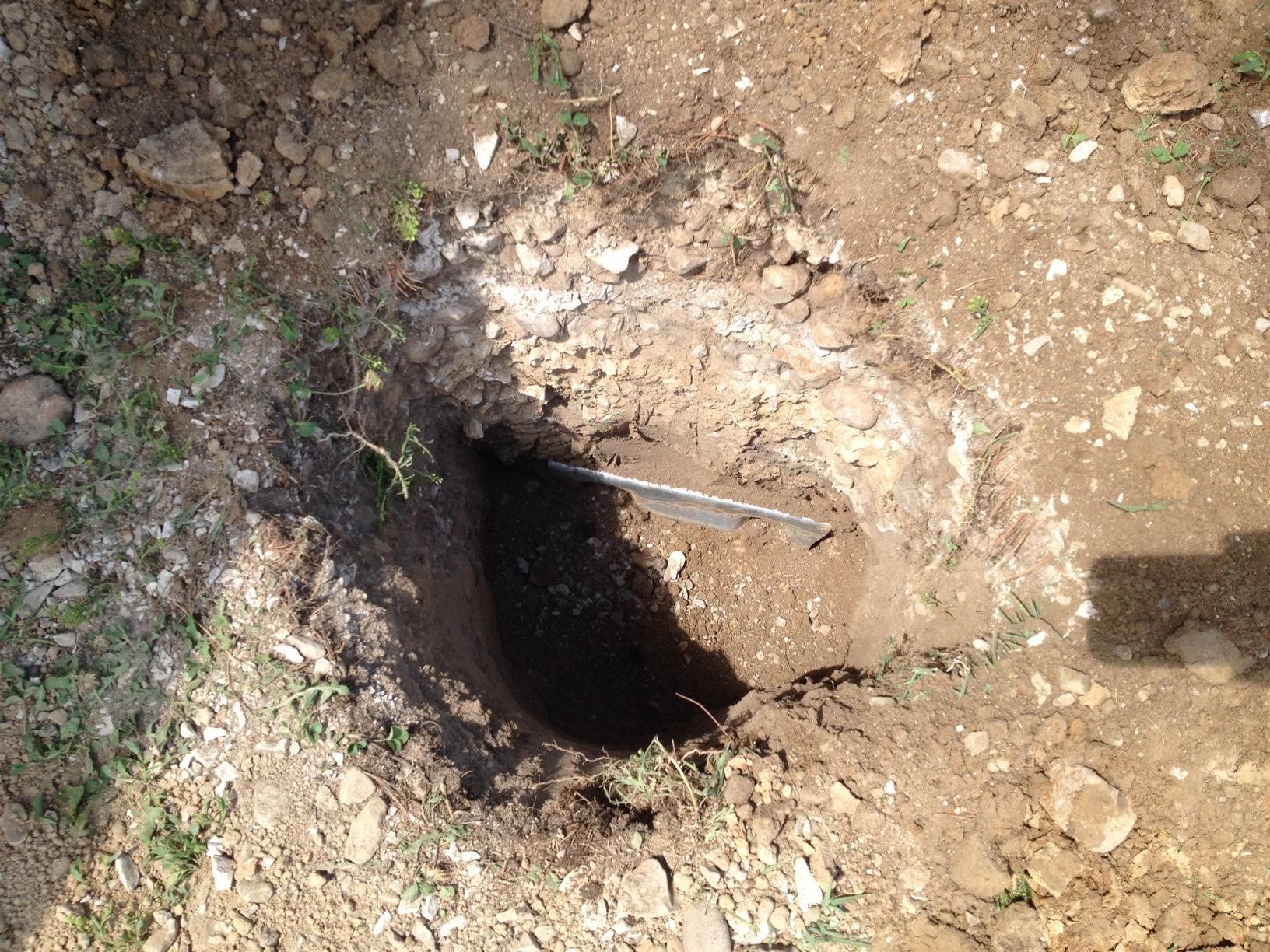 Wall Anchoring a Block Foundation in Belleville IL Filling the Earth Anchor Holes