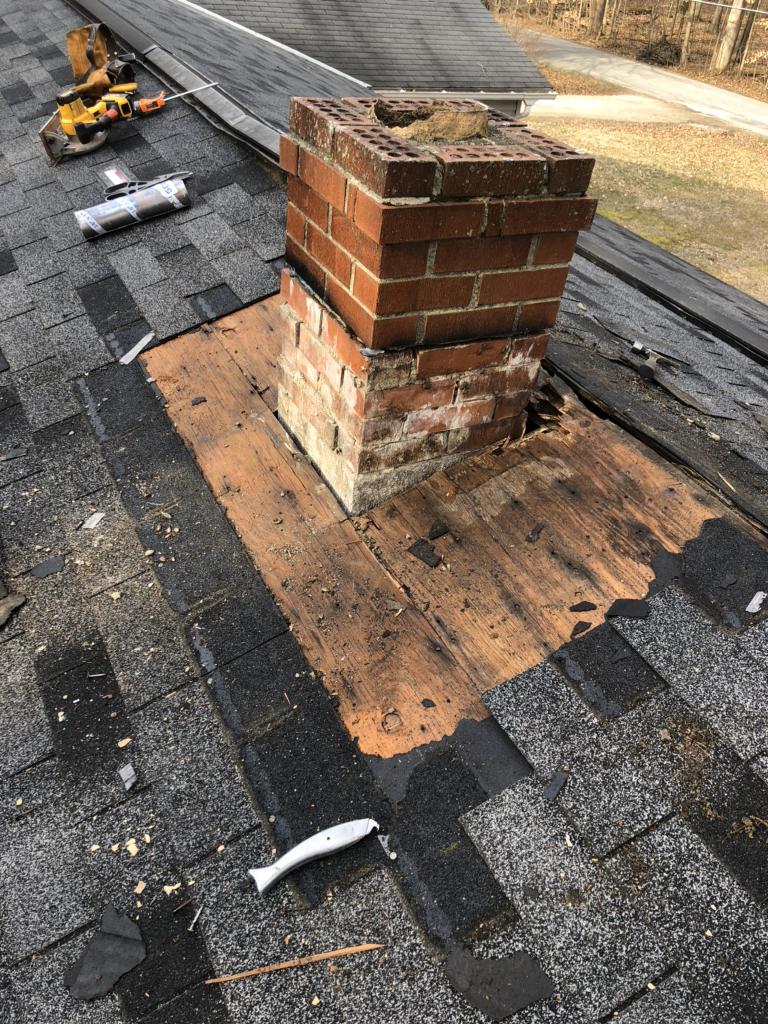 Leaking Roof around Chimney Repaired in Galion, OH Removing the old