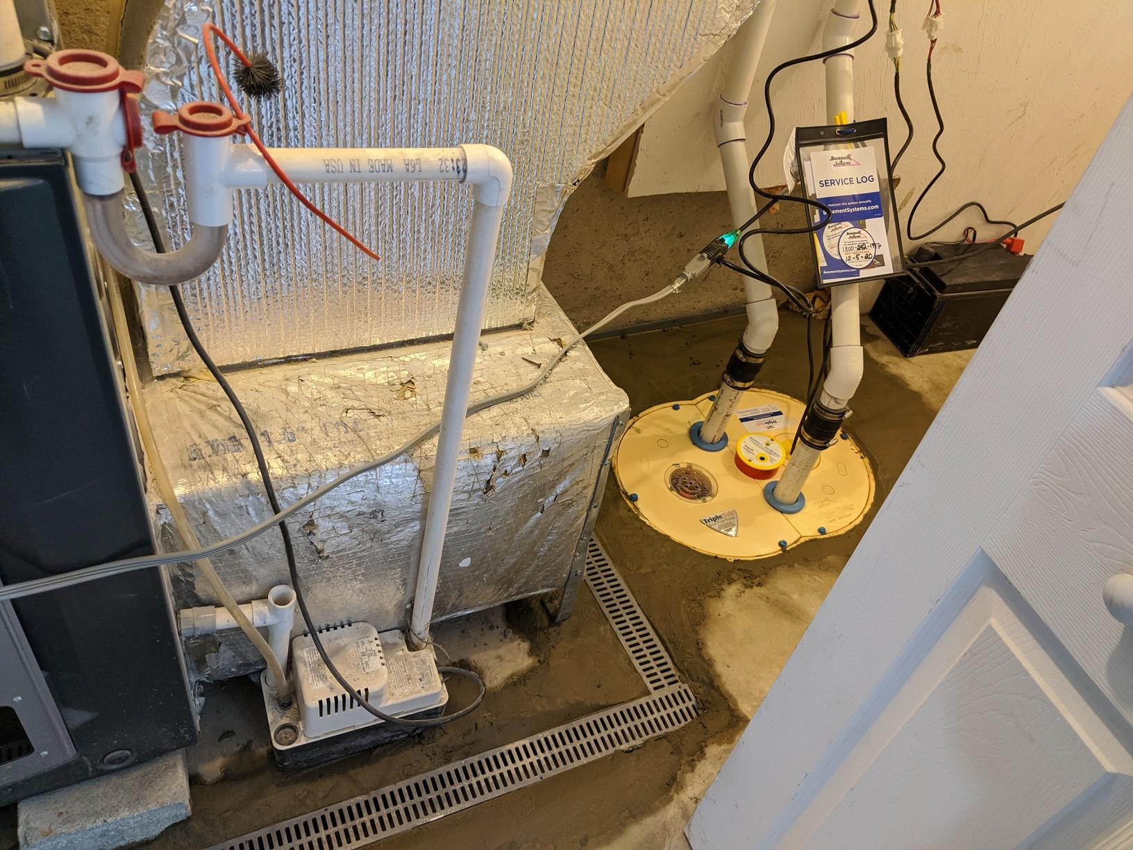 Leaking Boston, MA Basement Sump Removes Water