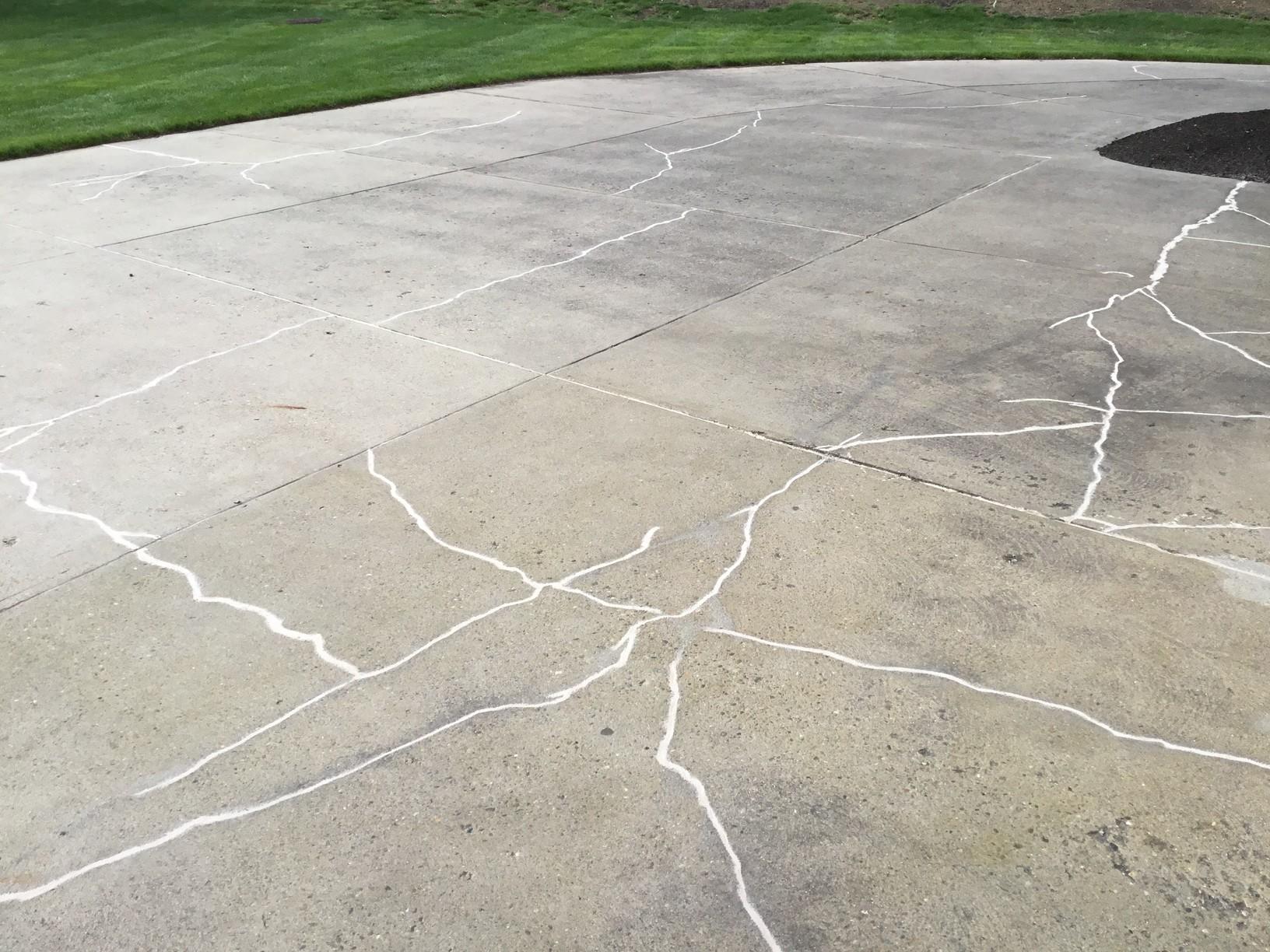 Concrete Lifting and Leveling Sunken slabs and cracks in a driveway