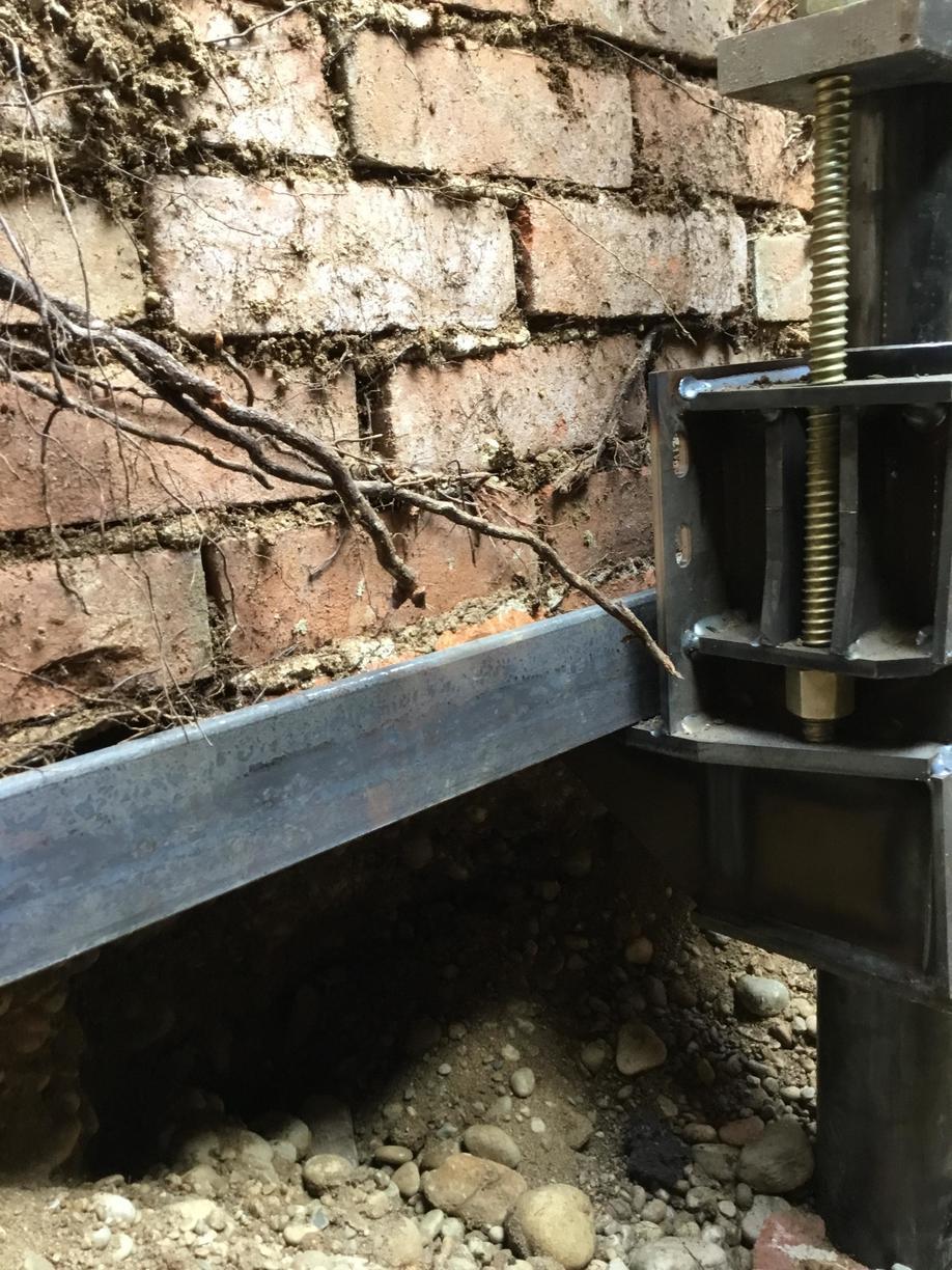 Commercial Foundations Helical Piers are used to stabilize a