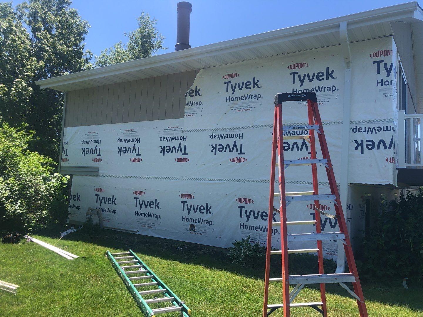 New siding, soffit and fascia wrap Weather Barrier