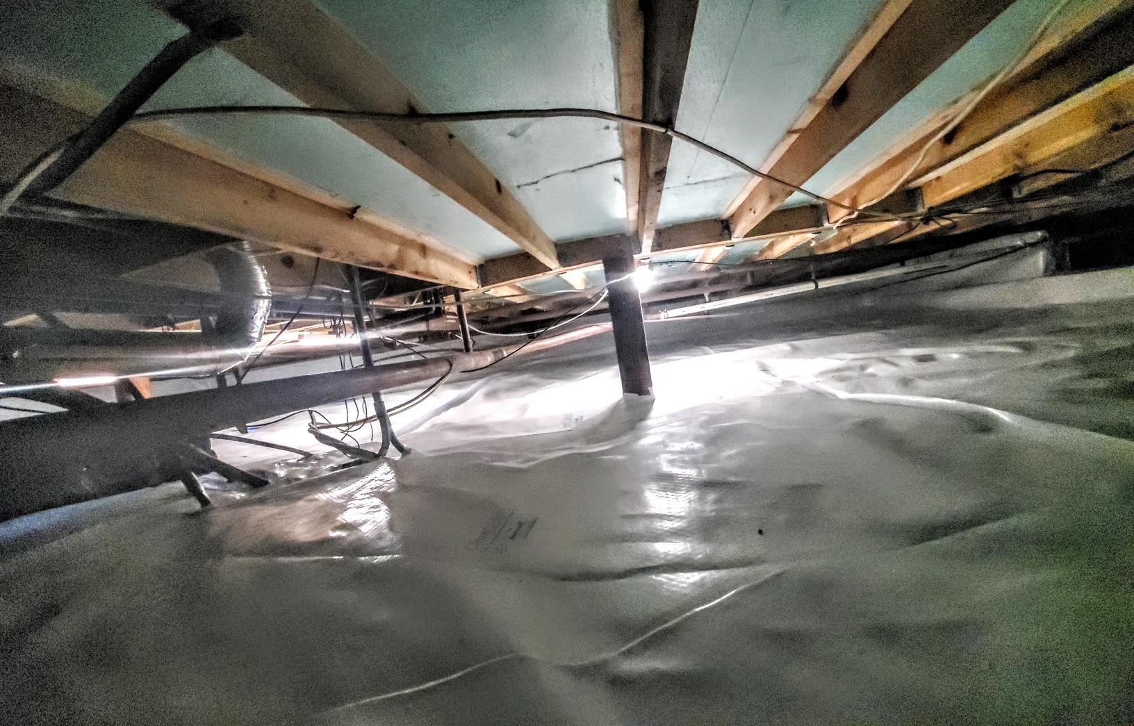 Attic Insulation Encapsulating A Crawl Space With CleanSpace & Hand