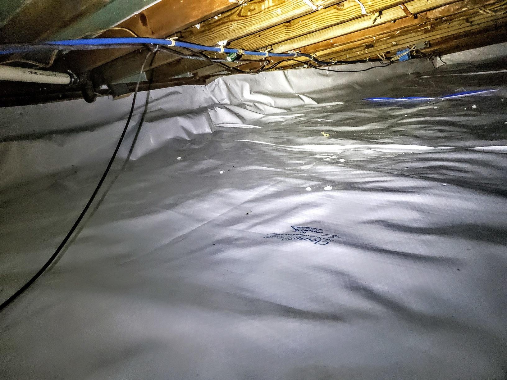 Attic Insulation Encapsulating A Crawl Space With CleanSpace & Hand
