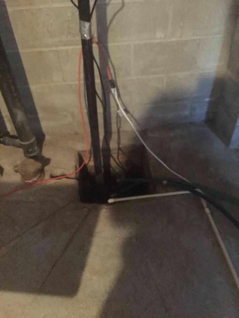 Wet Basement Threatens Mother's Health in Cannington, Ontario - Sump Pit