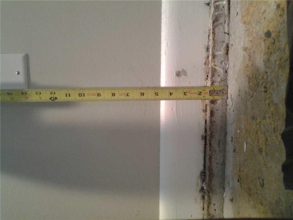 Concrete Lifting and Leveling Sinking Basement Gets a Lift from