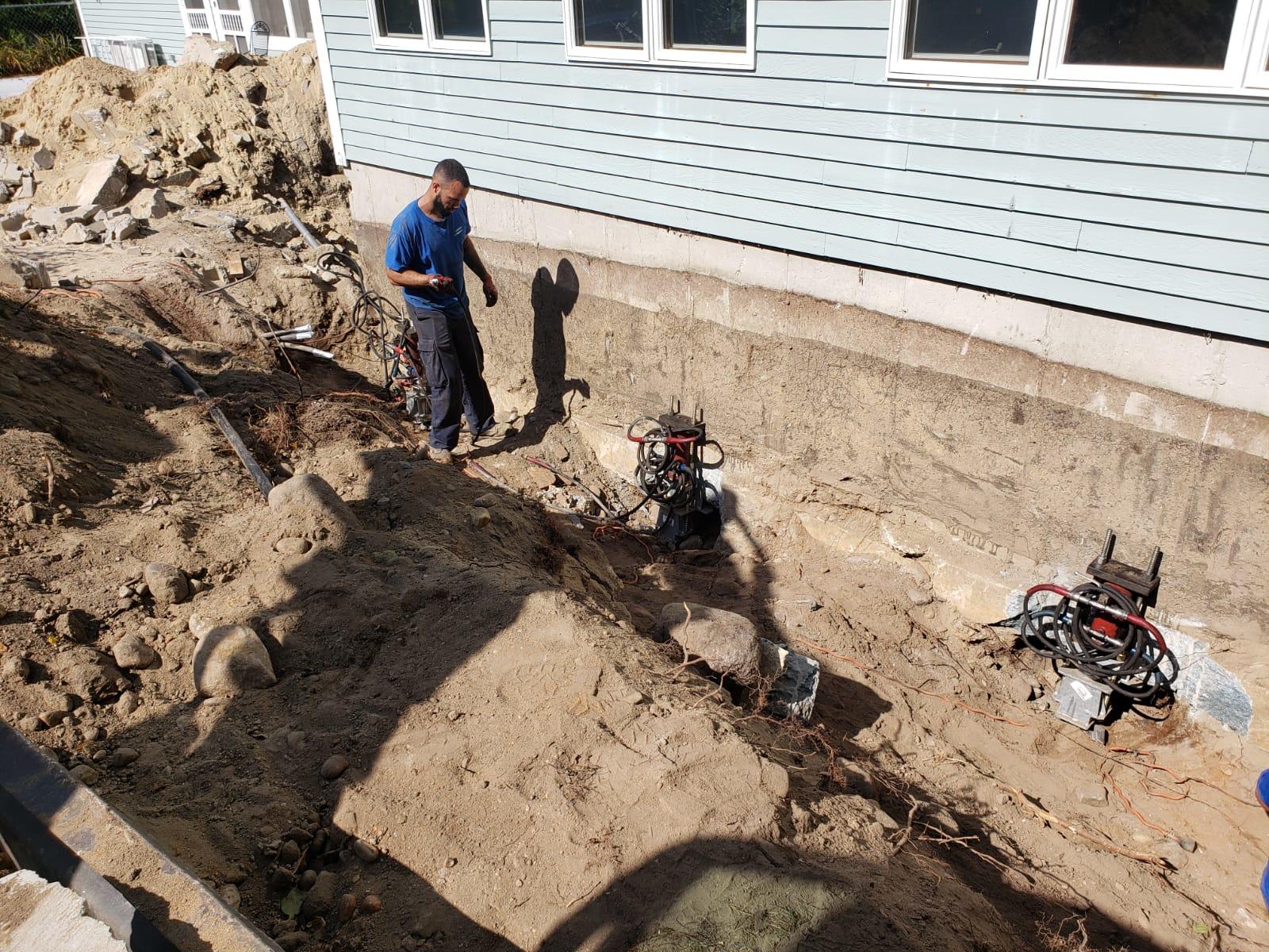 Settling Addition, Hooksett, NH Installing Push Piers