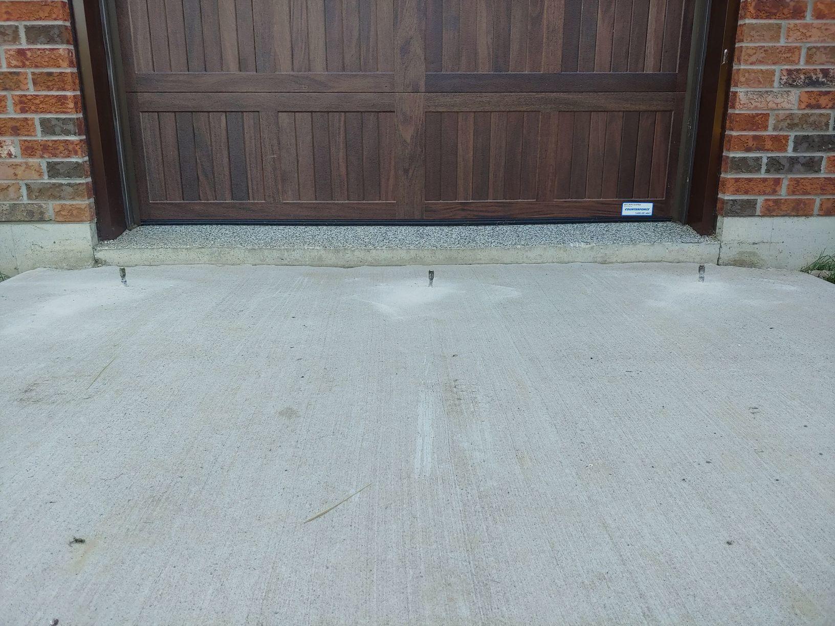 Sinking Driveway Causes Machinery to Damage Garage Floor in Port Perry