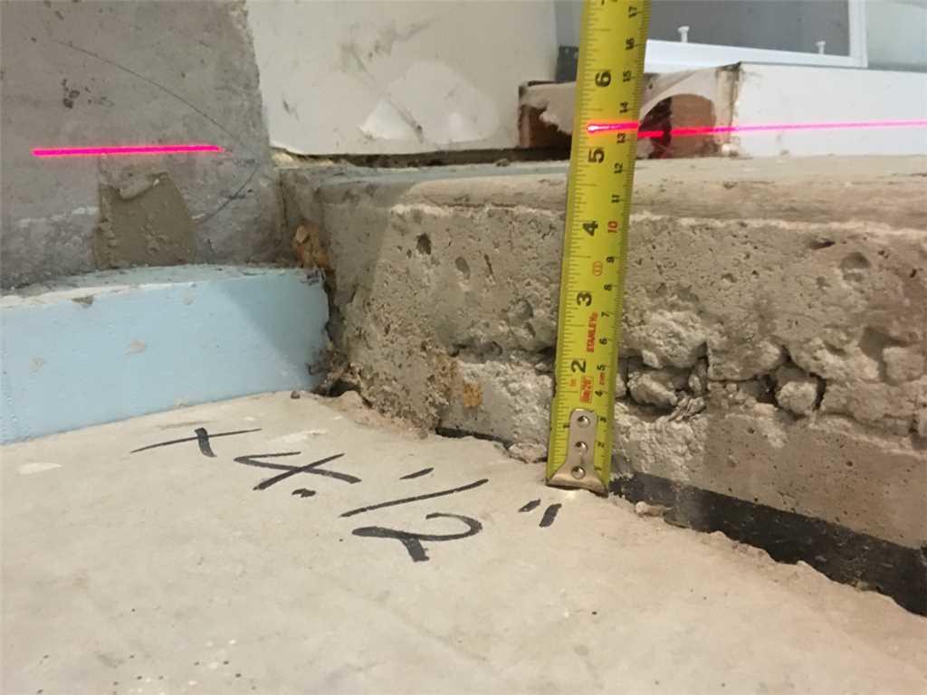 Residential Sinking Garage Floor Slopes Towards Basement in