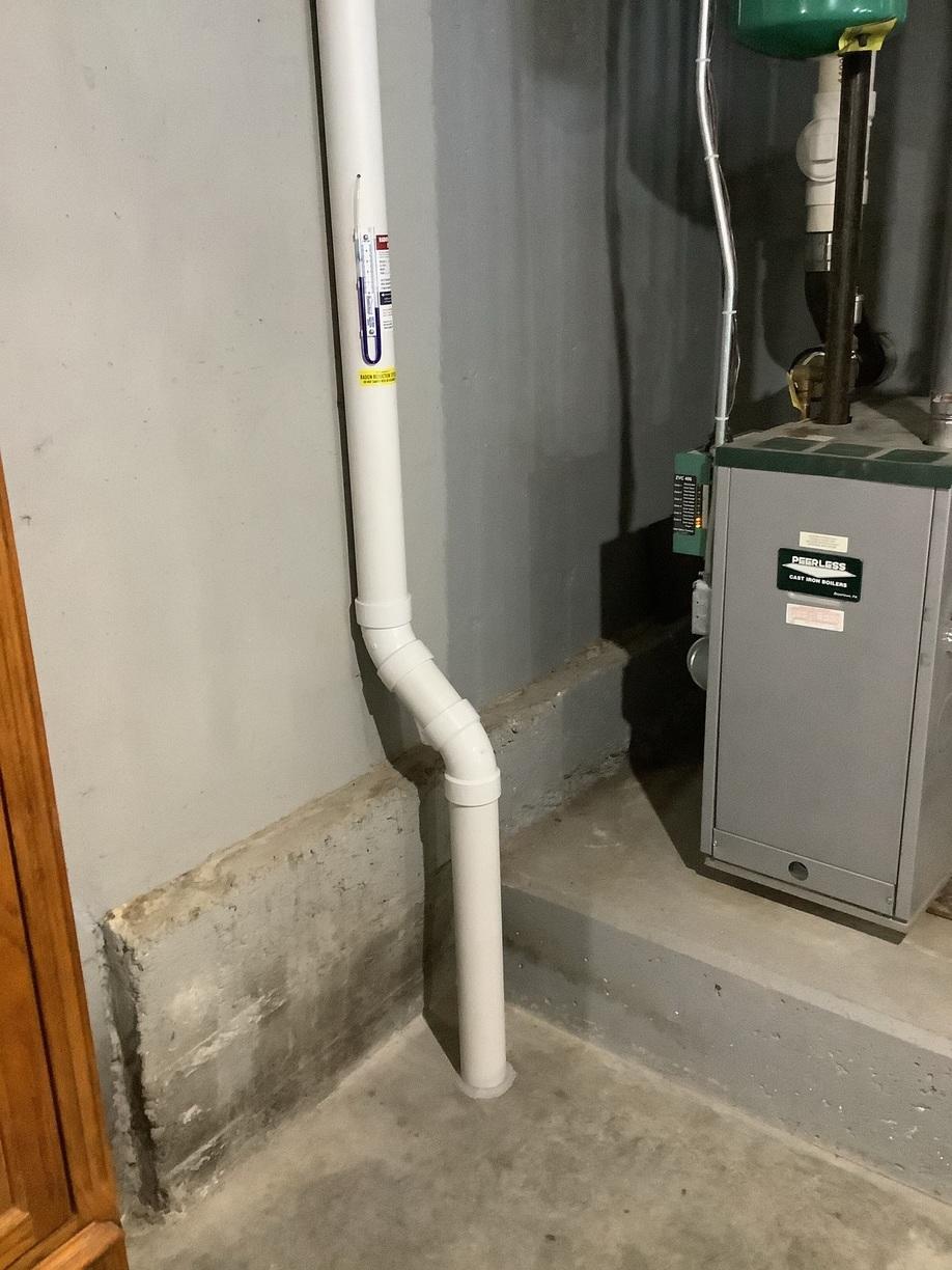 Radon Mitigation System, Windham, NH Radon Pipe from the Concrete Floor