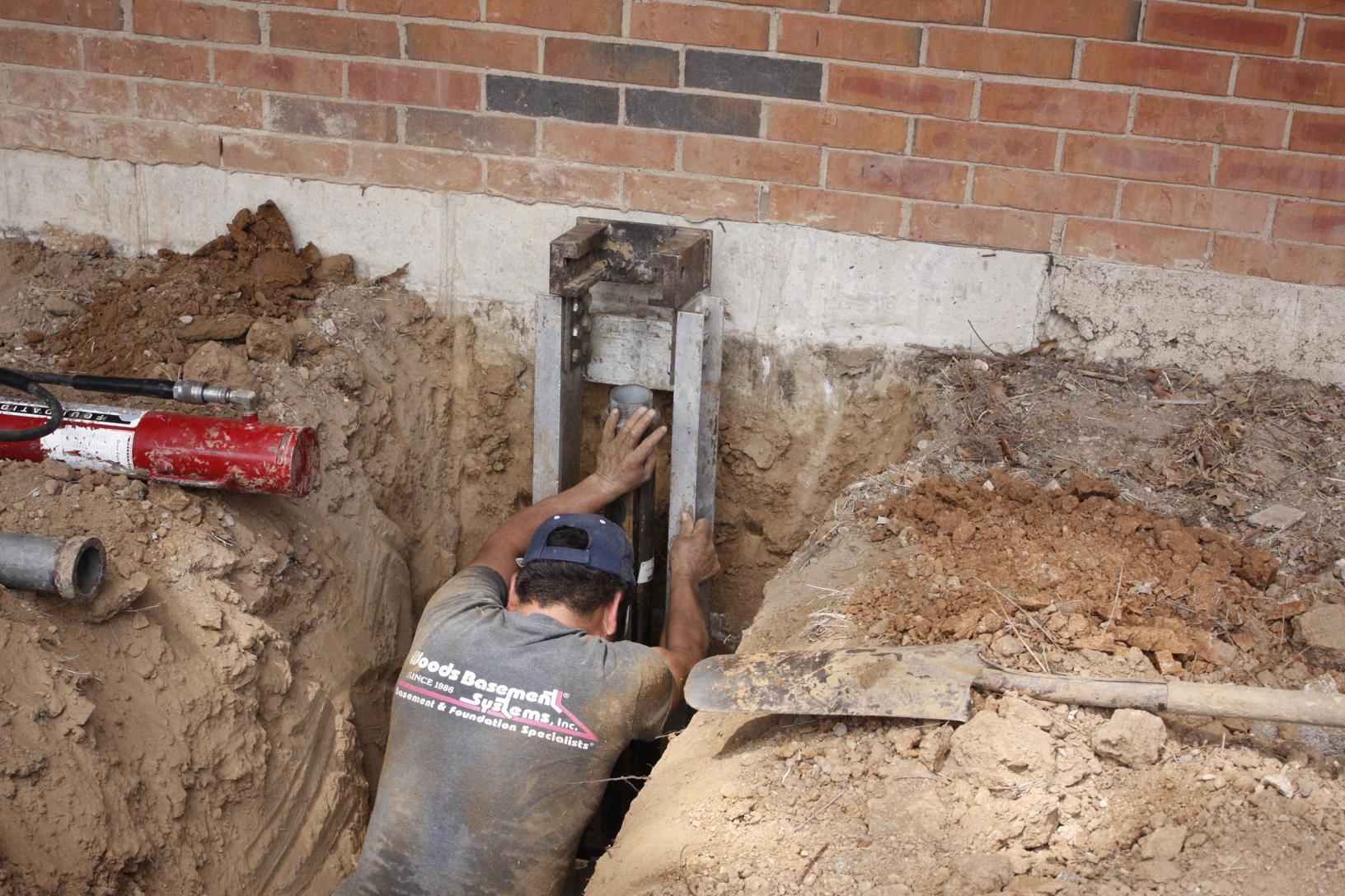 Foundation Repair Push Pier Install in Kirkwood, MO Setup brace is