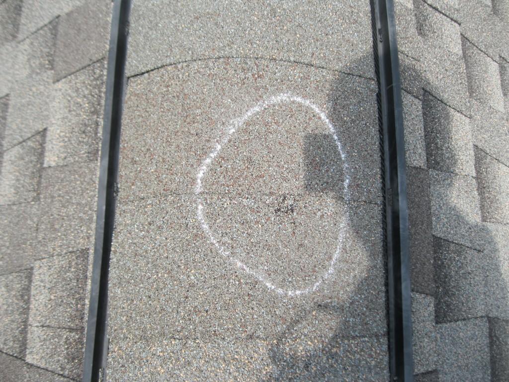 Roof Repair What does Hail damage look like? Hail damage to ridge