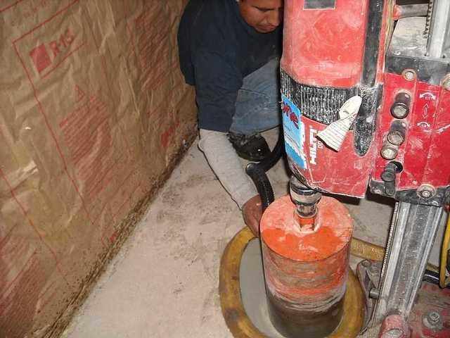 Drilling the holes for slab pier installation