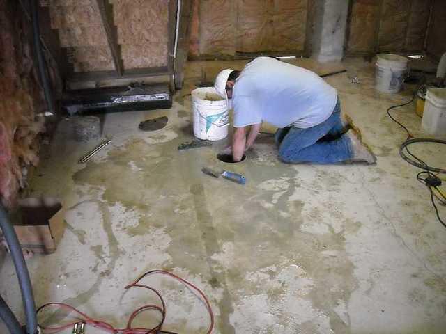 Digging out under the slab to make room for the bracket