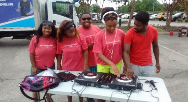 DJ Toonz gives the crowd a chance at the spinning table