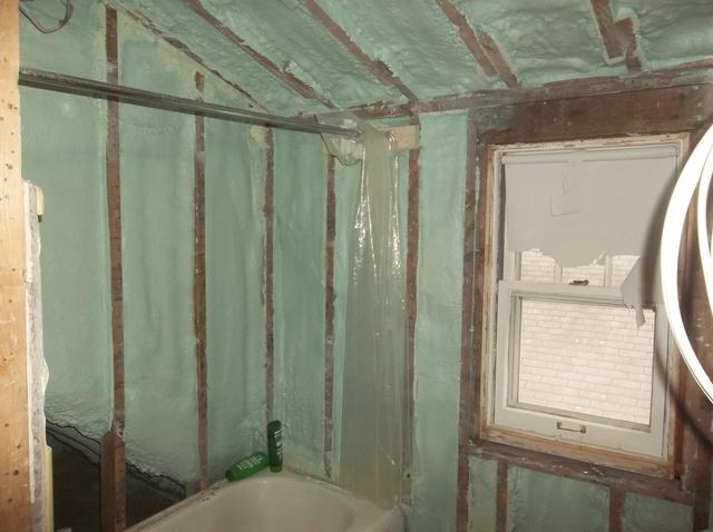 Spray Foam Installed Between Wall Studs and Rafters