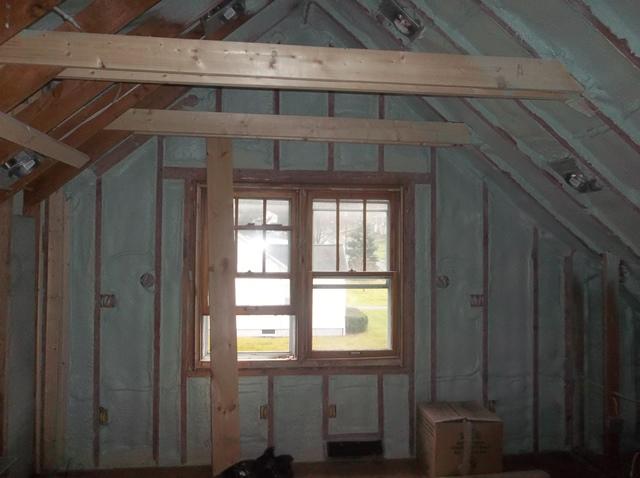 Spray Foam Installed Between Wall Studs and Rafters