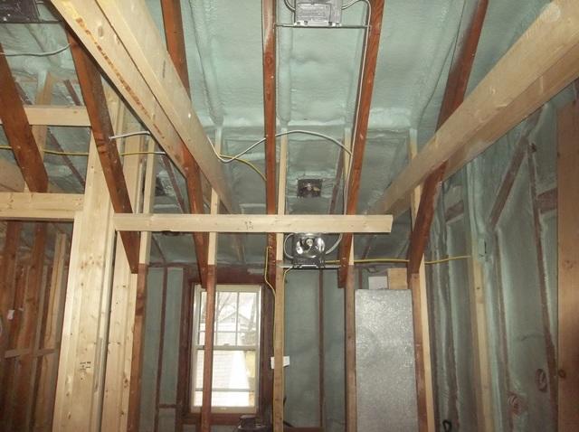 Spray Foam Installed Between Wall Studs and Rafters