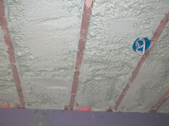 Spray Foam Installed Between Wall Studs and Rafters