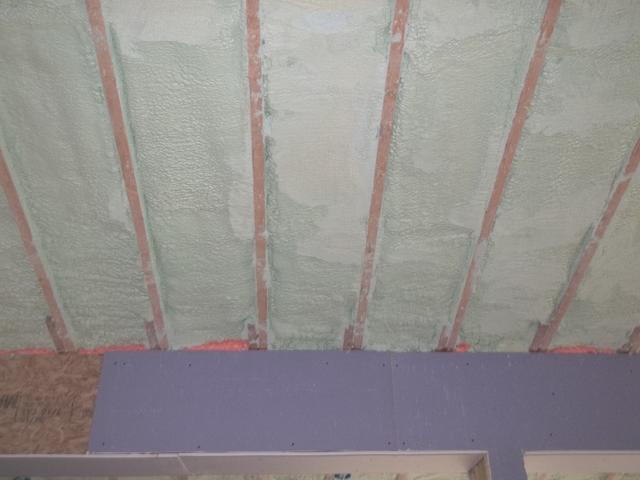 Spray Foam Installed Between Wall Studs and Rafters