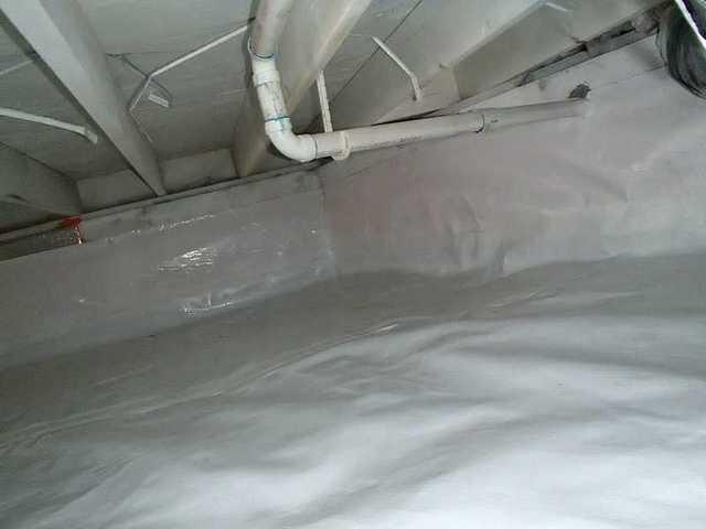 The crawl space is now in great shape with a interior CleanSpace liner, sump pump, dehumidifier, and water drainage mat.