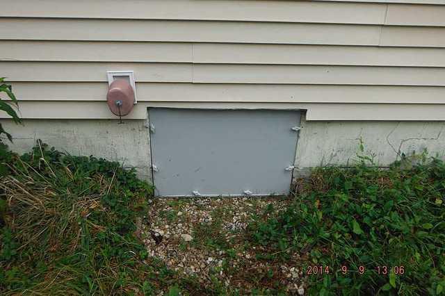 The Everlast crawl space door has been installed and the homeowners no longer need to worry about water, air, and animals entering the crawl space.