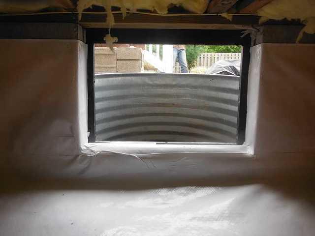 This image is from the inside of the crawl space looking out. What a great difference the encapsulation has made.