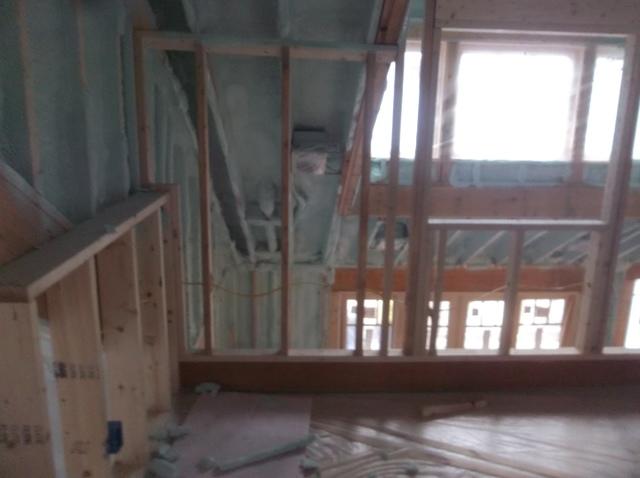 Spray Foam Installed Between Wall Studs and Rafters