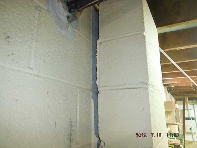 Bowing wall is barely hanging on