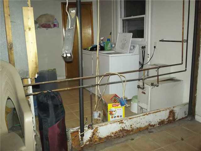 <p>This family in Castleton on Hudson, NY decided to separate their laundry room from the rest of the space with a new Everlast Wall</p>