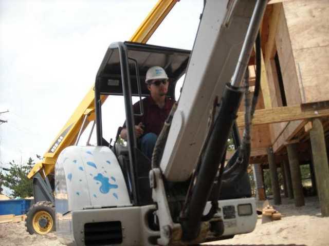 Project Foreman Kenny Sharpless on the mini excavator