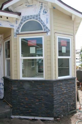 Home Exterior with new Masonry and Siding Installed