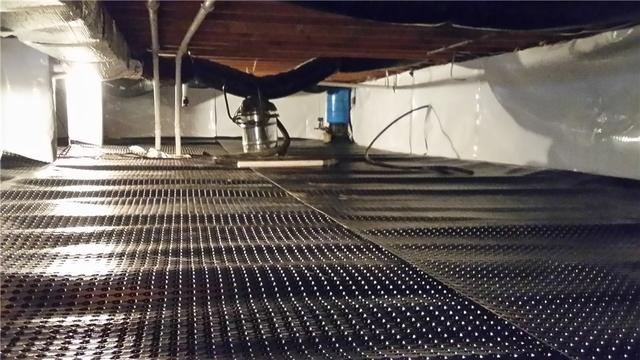 By installing this dimpled drainage matting between the ground and the CleanSpace material, the water has an easier time funneling to the sump pump.