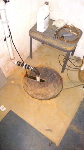 First, note the damage from the iron ochre. Secondly, while this pump was doing its best, it's almost impossible to keep up with a wet basement without some kind of perimeter system to actually direct the water to the sump pump.