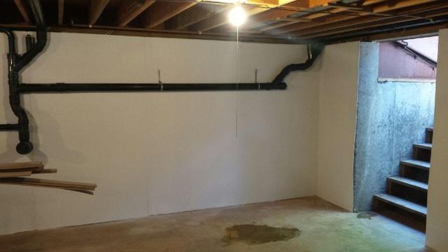 The BrightWall basement wall product is installed along basement walls that have moisture problems. This wall is mechanically fastened to the basement concrete wall and is used for a vapor barrier in most cases. This wall product also allows the customers basement to have a more finished look to it.