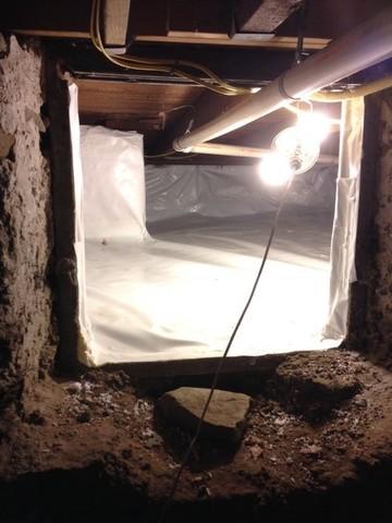 Shown here is the narrow entrance to the crawl space in Newport, Rhode Island. With the proper insulation of the crawl space it will help the rest of the basement and home with moisture and humidity problems in the future.