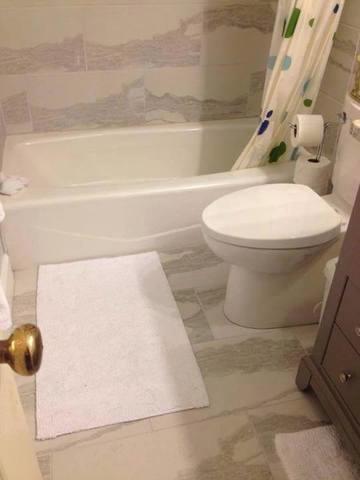 Stone Tiles Installed in Bathroom Remodel.