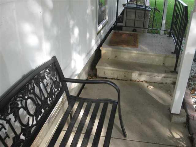 The outside stairs have moved away from the house due to soil settlement.