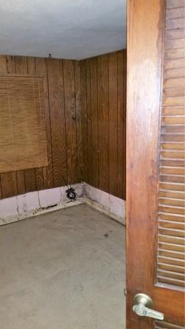 Paneling and Floors Show Damage