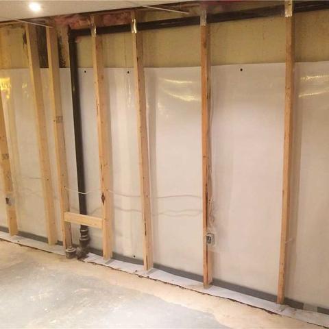 A view of the newly installed CleanSpace® vapor barrier and WaterGuard® french drain at the footing/wall join. Once cemented back into place and dried the basement will be ready to finish!
All of this work can be completed by simply removing the bottom plates of the existing framing, no need to completely gut the basement.