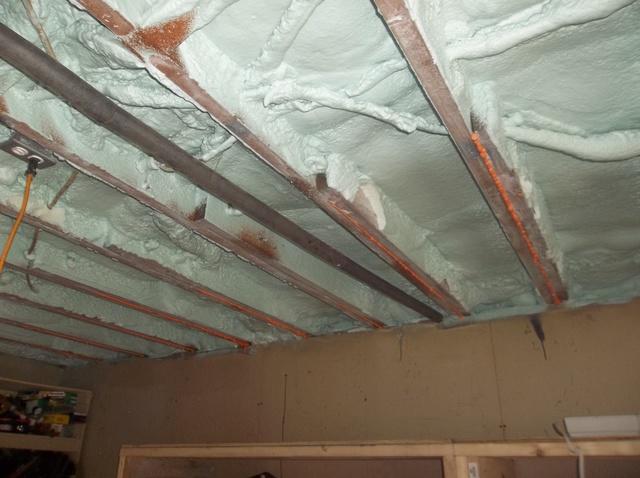 Garage Ceiling that was insulated with Spray Foam to seal the above floor from outside conditions.