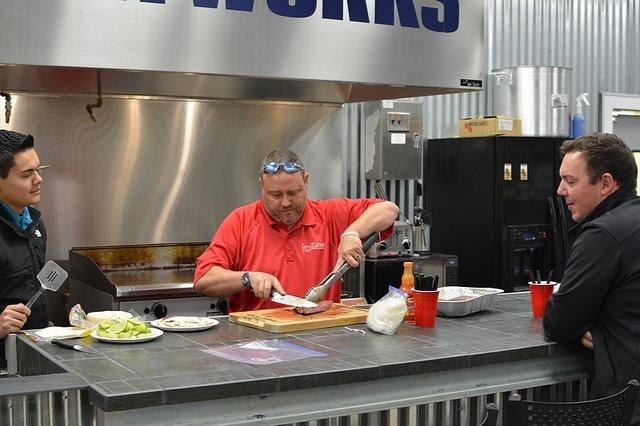 Bill putting on the final touches  while Martin and Brian wait .....