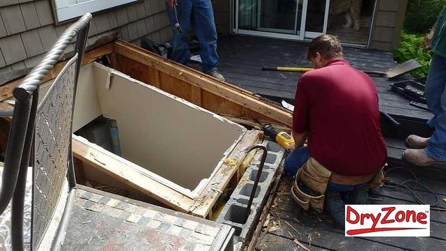 Kenny carefully removing the old, leaky skylight