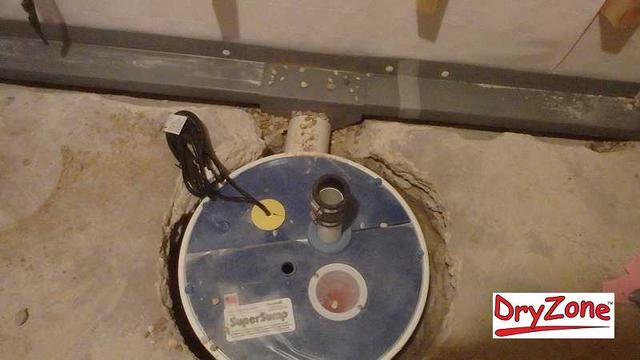 Installing a sump pump and a WaterGuard drainage system