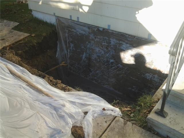 Digging out the location for Egress Window installation and RockWell window well.