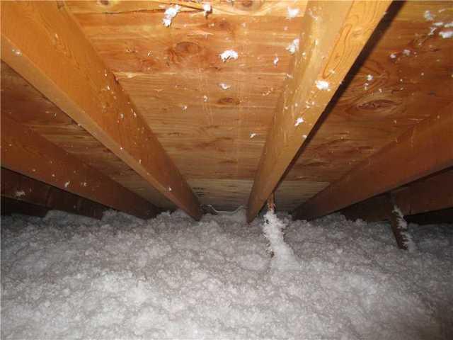 After we air sealed the attic with spray foam insulation we use blow in cellulose insulation to properly insulate this attic.