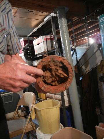 <p>Homeowner showing us his plugged drain tile.</p>